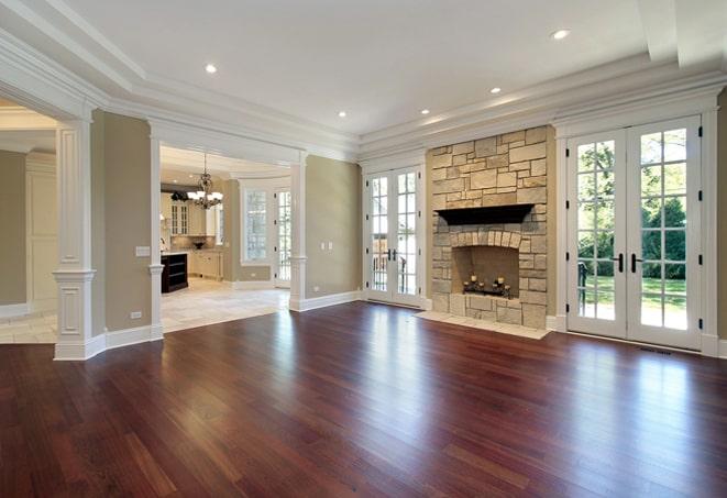 home gym featuring durable hardwood flooring